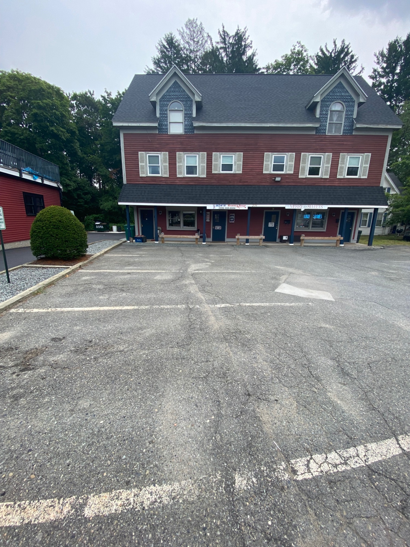 Exterior of Moe's Barber Shop in East Walpole, MA